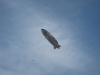 Loud blimp circles downtown